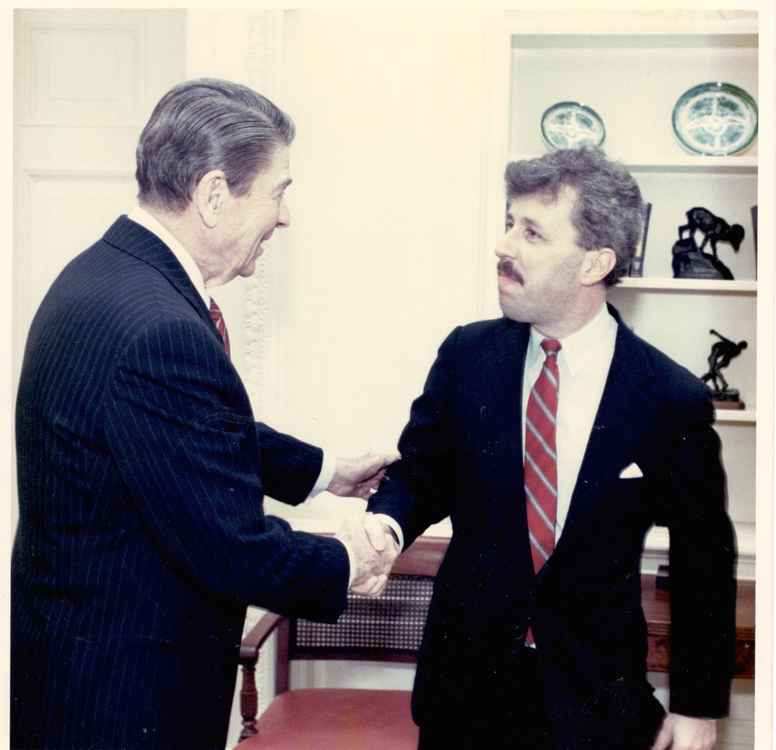 Pictured above: Jeffrey Lord with his former boss, President Ronald Reagan.
